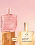 Nuxe Huile Prodigieuse Florale Or: Multi-Purpose Shimmering Dry Oil for Radiant Skin & Hair - Natural Glow, Floral Scent, Lightweight Formula, 1.69 fl oz Nuxe Shimmering Dry Oil - Radiant Skin, Floral Scent | Multi-Purpose shimmering dry oil, multi-purpose oil, floral body oil, radiant skin oil, natural glow oil, Nuxe Huile Prodigieuse Florale Or, pink gold shimmer oil, tsubaki oil skincare, argan oil hair treatment, body oil, hair oil, face oil, shimmering oil, floral scent, natural ingredients, lightweigh