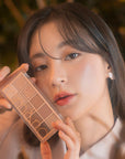rom&nd Dreamy Lilac Garden Eyeshadow Palette: Create Stunning Eye Looks with Matte & Shimmer Shades, High Pigment Korean Eye Makeup rom&nd Dreamy Lilac Eyeshadow: Korean Palette, Matte & Shimmer rom&nd eyeshadow palette, Korean eyeshadow palette, matte shimmer eyeshadow, long lasting eyeshadow, eye makeup palette, Dreamy Lilac Garden eyeshadow, high pigment eyeshadow, blendable eyeshadow, eyeshadow, eye shadow, eye makeup, makeup, cosmetics, beauty, lilac eyeshadow, purple eyeshadow, Korean beauty, K-beauty