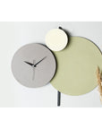 Muyika Handmade Metal Wall Clock - Unique Decorative Silent Sweep Clock for Home and Office (Green-Grey-Cream) Muyika Handmade Metal Wall Clock - Silent Sweep Decor handmade wall clock, metal wall clock, decorative clock, silent sweep clock, custom painted clock, unique home decor, artisanal decor, office decor, living room decor, handmade metal clock, Muyika, wall clock, home accessories, interior design, clock with silent mechanism