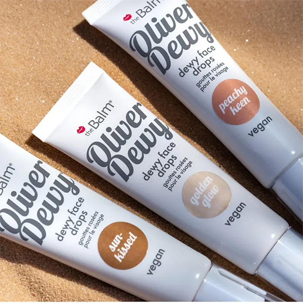 theBalm Oliver Dewy Face Drops: Achieve Radiant, Glowing Skin with this Illuminating Liquid Highlighter - Peachy Keen & Sun-Kissed Options theBalm Dewy Face Drops: Radiant Liquid Highlighter dewy face drops, liquid highlighter, theBalm highlighter, peachy keen highlighter, sun-kissed highlighter, golden glow highlighter, radiant glow makeup, illuminating face drops, highlighter, face illuminator, makeup, cosmetics, dewy finish, radiant skin, black currant oil, niacinamide, skincare, beauty, luminous skin, g