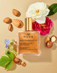 Nuxe Huile Prodigieuse Or: Shimmering Golden Dry Oil for Face, Body & Hair - Natural Multi-Purpose Illuminating Oil Nuxe Huile Prodigieuse Or: Shimmering Oil for Radiant Skin & Hair Nuxe Huile Prodigieuse Or, shimmering dry oil, golden shimmer oil, multi-purpose oil, natural beauty oil, face body hair oil, illuminating oil, pariltili kuru yag, altin pariltili yag, cosmetic oil, face oil, body oil, hair oil, natural ingredients, shimmering oil, golden oil, radiant skin, luminous skin, dry oil, non-greasy, hy
