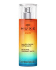 Nuxe Sun Eau Delicieuse Parfumante Body Spray - Tropical Summer Scent with Coconut & Tiare Flower | 30ml Nuxe Sun Body Spray: Tropical Coconut Summer Beach Scent Nuxe Sun fragrance, body spray, summer scent, tropical fragrance, coconut body mist, natural body spray, eau delicieuse parfumante, tiare flower perfume, sun inspired fragrance, beach scent, Nuxe, body mist, perfume, fragrance, tropical, coconut, tiare flower, natural, summer, beach, sweet orange, petitgrain, vanilla, musk, women's fragrance, light