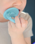 OiOi Baby Silicone Teether Toy - Soft Gum Soother for Teething Relief, 3 Months+, Green OiOi Silicone Baby Teether - Teething Relief for Infants baby teether, silicone teether, teething relief, baby gum soother, infant teething toy, OiOi, baby products, teething toys, baby essentials, baby gifts, newborn care, baby comfort, teething pain relief, silicone baby products