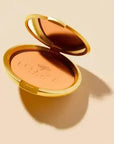 Nuxe Bronzing Compact Powder: Achieve a Radiant Sun-Kissed Glow - Natural Ingredients, Multi-Purpose Face & Body Bronzer, Non-Comedogenic Nuxe Bronzer: Radiant, Sun-Kissed Glow - Natural Ingredients bronzing powder, compact bronzer, natural bronzer, jasmine bronzer, face bronzer, body bronzer, Nuxe bronzer, non-comedogenic bronzer, bronzing powder for all skin types, radiant bronzing powder, bronzer, compact powder, natural cosmetics, jasmine flower, face makeup, body makeup, sun-kissed glow, healthy glow,
