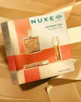 Nuxe Infinite Glow: Skincare Gift Set - Hydrating Dry Oil, Lip Balm & Radiance Enhancer | Nuxe Huile Prodigieuse & Reve de Miel Included Nuxe Gift Set: Radiant Skin w/ Huile Prodigieuse & Lip Balm Nuxe gift set, skincare gift set, beauty gift set, dry oil skincare, lip balm, radiance enhancing skincare, Nuxe Huile Prodigieuse, Nuxe Reve de Miel, moisturizing skincare set, gift set for women, dry oil, skincare, beauty, moisturizing, radiance, lip care, gift for her, gift for women, skincare routine, Nuxe ski