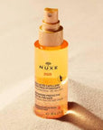 Nuxe Sun: UV Protection Moisturizing Hair Oil - Water Resistant Beach & Summer Hair Care, Protects from Sun, Salt & Chlorine - 3.38 fl oz Nuxe Sun Hair Oil - UV Protection, Moisturizing for Beach & Summer hair oil, sun protection hair, moisturizing hair oil, UV protection hair spray, water resistant hair protection, beach hair protection, summer hair care, Nuxe Sun hair oil, hair sunscreen, chlorine protection hair, hair care, UV protection, moisturizing, water-resistant, lightweight, summer fragrance, dual
