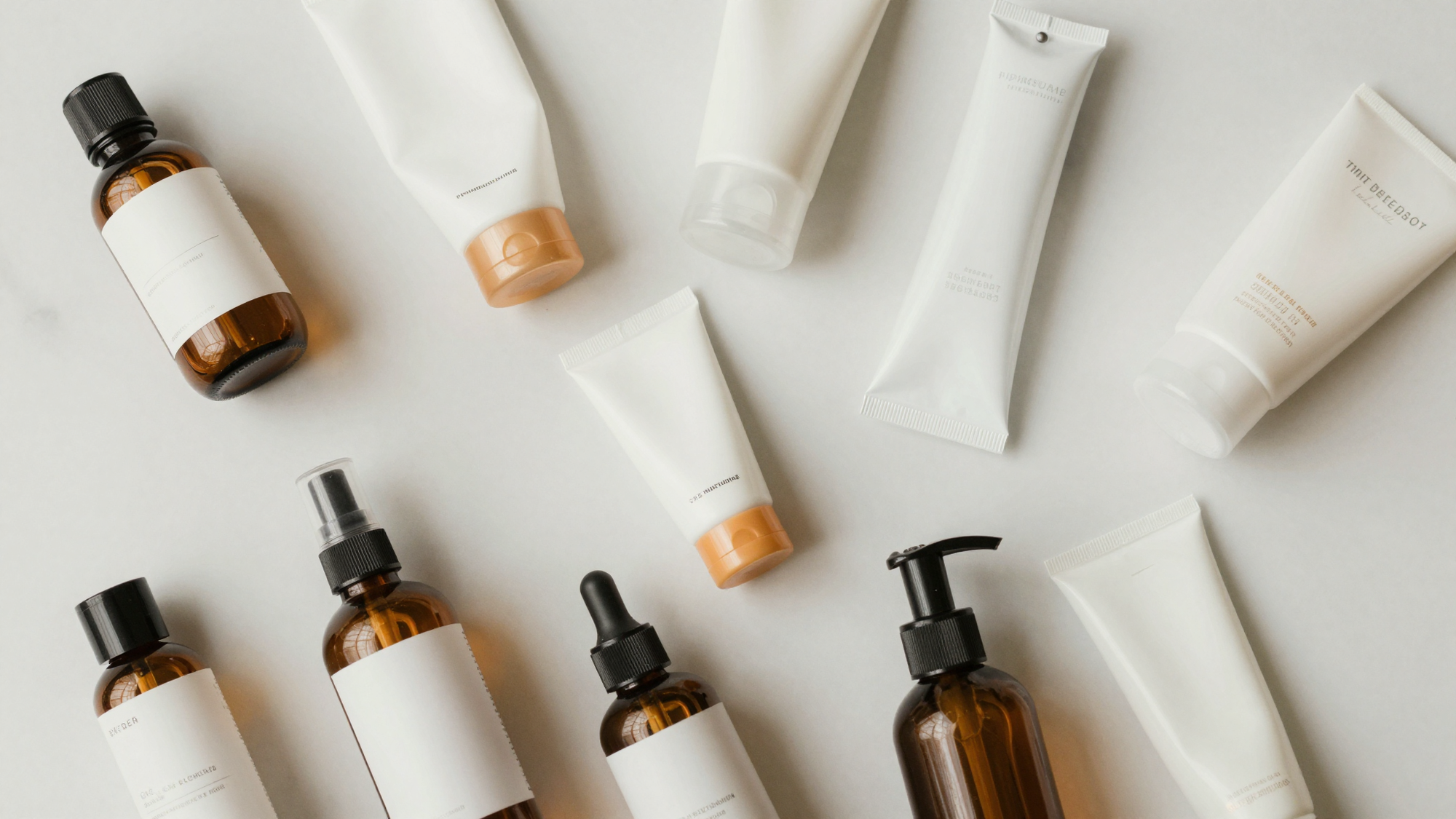 A collection of assorted skincare products on a marble countertop, depicting a pharmacy skincare selection.