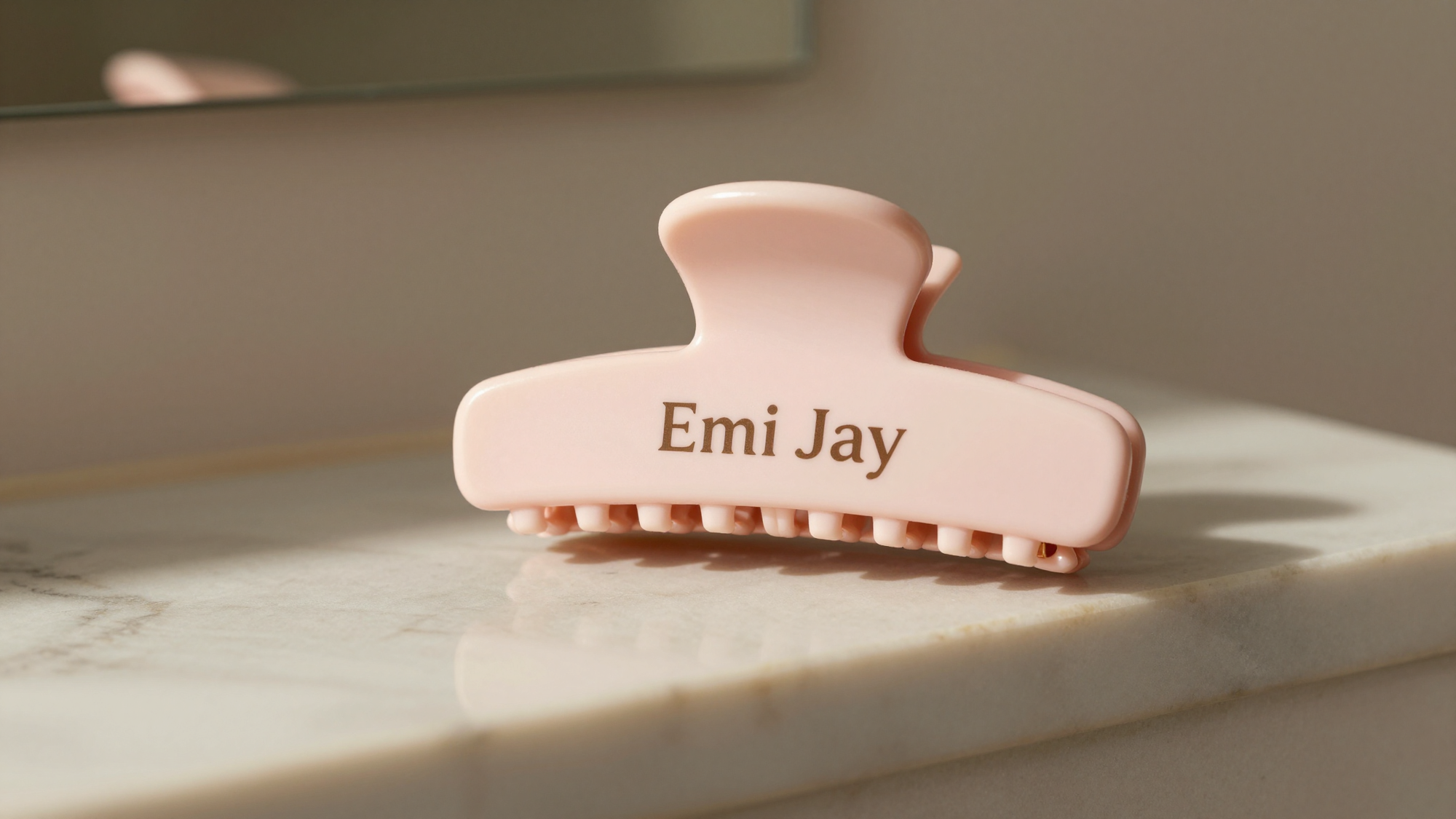 Gentle hair clip on a marble bathroom shelf