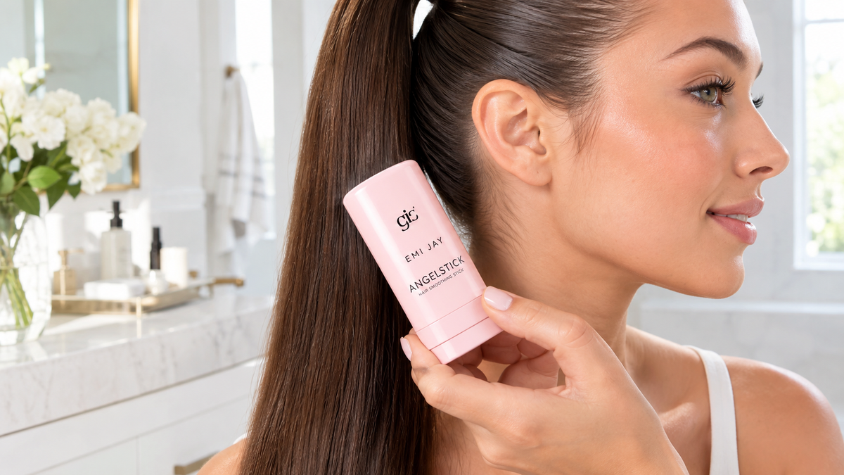Hand holding an Angelstick hair smoothing stick while taming flyaways
