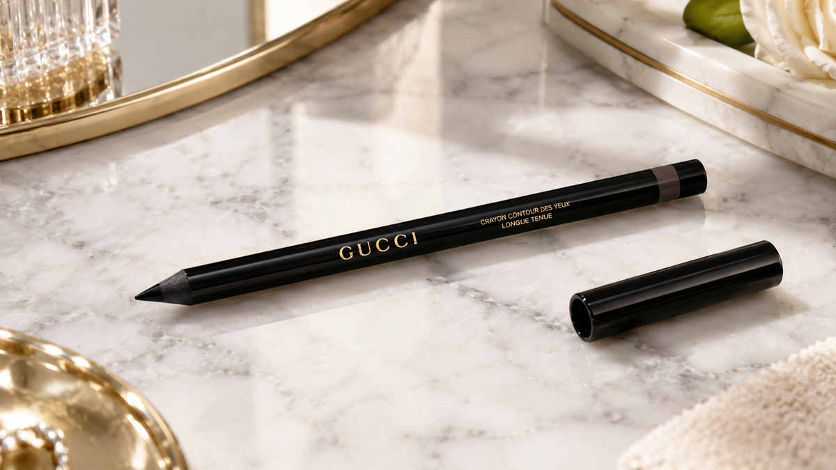 Gucci eyeliner pencil on marble surface with natural light