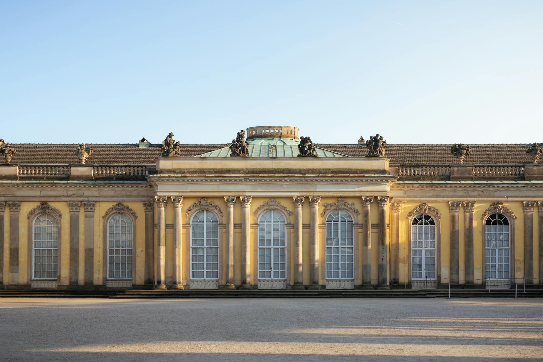 Front view of the historic Sanssouci Palace in Potsdam, highlighting its elegant architecture.