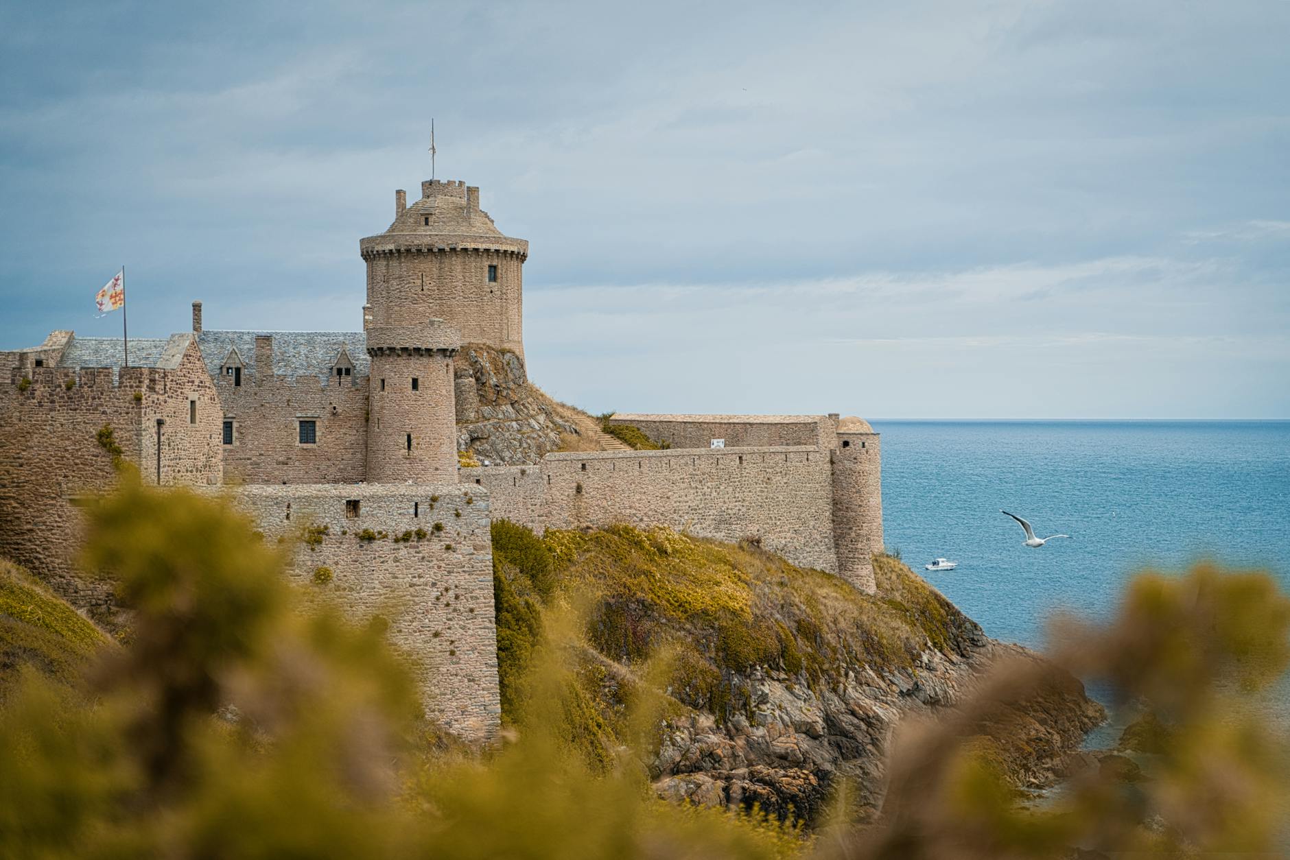 Explore the ancient Fort La Latte perched by the sea in Brittany, France. A stunning historical landmark.