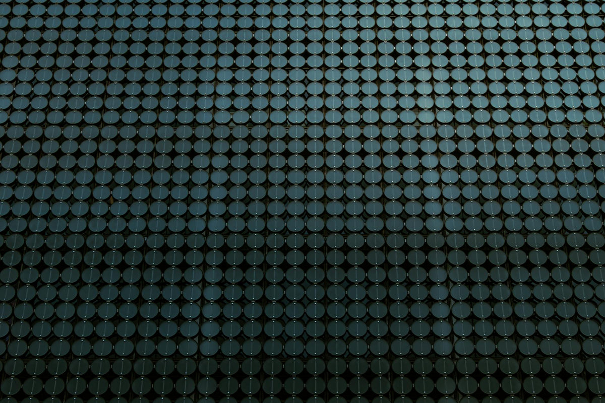 Close-up of a modern architectural facade featuring circular motifs in a geometric pattern.