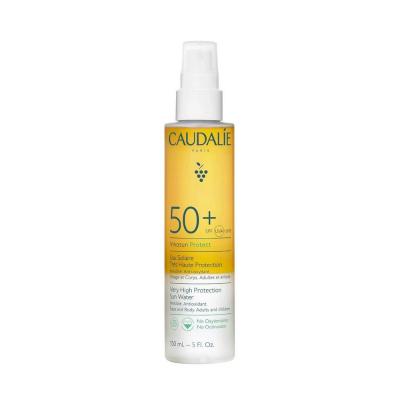 caudalie sunscreen water spf50 bottle, applying caudalie sunscreen water Caudalie Sunscreen Water SPF50 - High Protection | 150 ml Caudalie Sunscreen Water SPF50 – High Protection sunscreen, spf50, caudalie, outdoor-skin-care, vegan-sunscreen, high-protection, children-safe, face-body-hair, non-greasy, ai-generated