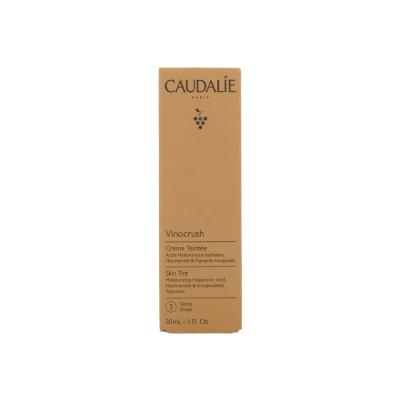 caudalie vinocrush skin tint ton 3 packaging, model applying caudalie vinocrush skin tint Caudalie Vinocrush Skin Tint Ton 3 | Lightweight Tinted Cream Caudalie Vinocrush Skin Tint Ton 3 - Lightweight Formula vinocrush-skin-tint, caudalie, lightweight-tinted-cream, skin-care, makeup, beauty-enthusiasts, young-women, natural-glow, moisturizing-cream, ai-generated