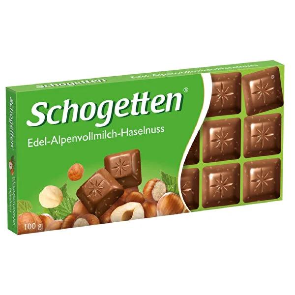 Schogetten Alpine Milk Chocolate Hazelnut Bar - Delicious German Chocolate Candy, Breakable Pieces, Creamy & Crunchy 100g Treat Schogetten Hazelnut Chocolate - Creamy Alpine Milk Chocolate Bar Schogetten chocolate, hazelnut chocolate bar, alpine milk chocolate, chocolate snack, German chocolate candy, chocolate with hazelnuts, breakable chocolate pieces, 100 gr chocolate, chocolate candy bar, sweet treat, coffee companion, tea pairing, creamy chocolate, crunchy chocolate, snack size chocolate, European choc