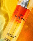 Nuxe Sun Eau Delicieuse Parfumante: Tropical Tiare & Vanilla - Natural Summer Perfume, Moisturizing Sun Scent Nuxe Sun Perfume: Tiare & Vanilla - Summer Fragrance Nuxe Sun Eau Delicieuse Parfumante, summer fragrance, natural perfume, bergamot tiare fragrance, moisturizing perfume, sun scent, tiare flower perfume, vanilla incense perfume, perfume, fragrance, bergamot, tiare flower, incense, vanilla, Tiaré flower oil, natural ingredients, summer scent, tropical scent, floral perfume, women's perfume, eau de p