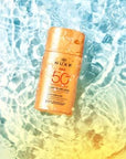 Nuxe Sun SPF 50 Facial Sunscreen: Lightweight Anti-Aging Sun Protection for Face, Water Resistant - 50ml Nuxe Sun SPF 50: Anti-Aging Facial Sunscreen SPF 50 sunscreen, facial sunscreen, sun protection, anti-aging sunscreen, water resistant sunscreen, lightweight sunscreen, sunscreen for face, sunscreen for normal skin, sunscreen for combination skin, sunscreen, face sunscreen, broad spectrum sunscreen, non-greasy sunscreen, Tahitian Gardenia, Vanilla, sun protection for face, anti-aging, skincare, beauty, p