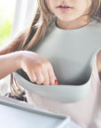 OiOi Basics Baby Bib - Soft Silicone, Easy Clean, and Sterilizable for Sensitive Skin OiOi Basics Baby Bib - Soft & Easy Clean baby bib, silicone bib, food-grade silicone baby products, easy clean baby bib, sterilizable baby bib, baby feeding accessories, baby essentials, baby gifts, newborn gifts, baby shower gifts, mealtime accessories