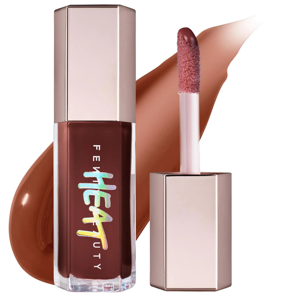 Fenty Beauty Gloss Bomb Heat: Lip Plumper & Luminizer - Fuller Lips, High Shine, & Subtle Tint with Shea Butter & Vitamin E Fenty Beauty Gloss Bomb Heat: Lip Plumper for Fuller, Shinier Lips lip plumper, lip luminizer, gloss bomb heat, fuller lips, shiny lip gloss, cruelty-free lip gloss, gluten-free lip gloss, lip gloss with shea butter, vitamin e lip gloss, tinted lip plumper, lip gloss, lip shine, plumping gloss, hydrating lip gloss, moisturizing lip gloss, lip care, beauty, cosmetics, makeup, shea butte