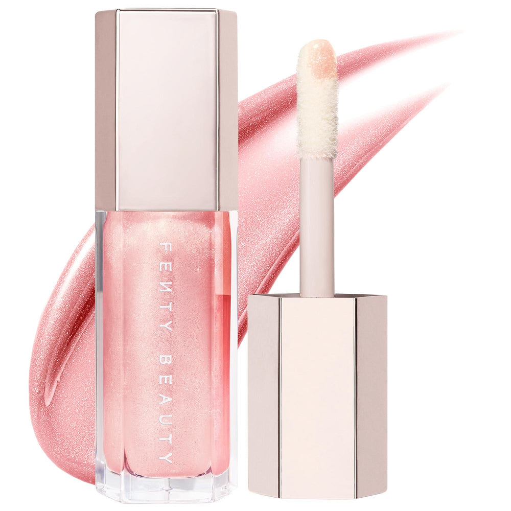 Fenty Beauty Gloss Bomb: Universal Lip Luminizer - Explosive Shine, Non-Sticky Formula, Peach Vanilla Scent, and Hydrating Shea Butter Fenty Beauty Gloss Bomb: Shine Lip Gloss, Peach Vanilla Scent lip gloss, shine lip gloss, universal lip luminizer, non-sticky lip gloss, peach vanilla lip gloss, cruelty-free lip gloss, shea butter lip gloss, gloss bomb, lip makeup, best lip gloss, lip luminizer, high shine gloss, hydrating lip gloss, flavored lip gloss, makeup, beauty, cosmetics, lip care, Rihanna, universa