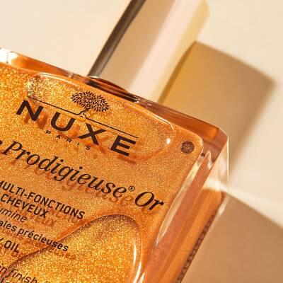 Nuxe Huile Prodigieuse Or: Golden Shimmer Dry Body &amp; Hair Oil for Radiant Skin - Natural, Multi-Purpose, Paraben-Free, Hydrating - 100 ml Nuxe Golden Shimmer Oil: Radiant Skin &amp; Hair Hydration Nuxe Huile Prodigieuse Or, Golden shimmer dry oil, Multi-purpose hair oil, Natural dry oil, Shimmer body oil, Hydrating hair oil, Paraben-free oil, Radiant skin oil, Golden glow oil, dry body oil, hair oil, shimmer oil, body oil, natural ingredients, paraben-free, vitamin E, moisturizer, radiant skin, glowing skin, hy