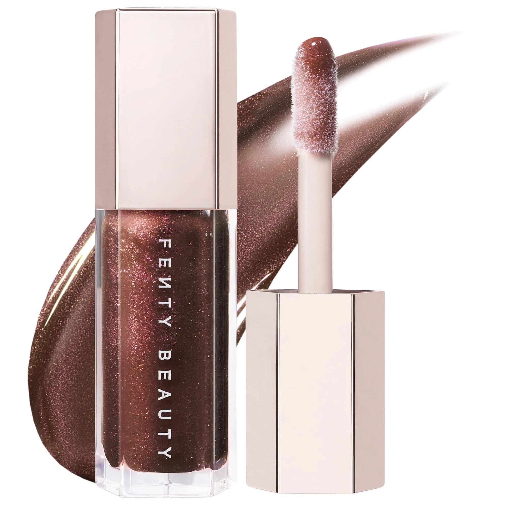 Fenty Beauty Gloss Bomb: Universal Shine Lip Luminizer - Non-Sticky, Hydrating Peach Vanilla Lip Gloss for All Skin Tones Fenty Beauty Gloss Bomb: Shine Lip Gloss For All Skin Tones lip gloss, shine lip gloss, universal lip luminizer, non-sticky lip gloss, peach vanilla lip gloss, hydrating lip gloss, cruelty-free lip gloss, best lip gloss for shine, lip luminizer, high shine gloss, moisturizing lip gloss, comfortable lip gloss, beauty, cosmetics, makeup, lip care, universal shade, XXL wand, shea butter, pe