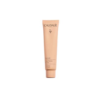 caudalie vinocrush skin tint ton 3 packaging, model applying caudalie vinocrush skin tint Caudalie Vinocrush Skin Tint Ton 3 | Lightweight Tinted Cream Caudalie Vinocrush Skin Tint Ton 3 - Lightweight Formula vinocrush-skin-tint, caudalie, lightweight-tinted-cream, skin-care, makeup, beauty-enthusiasts, young-women, natural-glow, moisturizing-cream, ai-generated