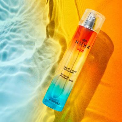 Nuxe Sun Eau Delicieuse Parfumante: Tropical Tiare & Vanilla - Natural Summer Perfume, Moisturizing Sun Scent Nuxe Sun Perfume: Tiare & Vanilla - Summer Fragrance Nuxe Sun Eau Delicieuse Parfumante, summer fragrance, natural perfume, bergamot tiare fragrance, moisturizing perfume, sun scent, tiare flower perfume, vanilla incense perfume, perfume, fragrance, bergamot, tiare flower, incense, vanilla, Tiaré flower oil, natural ingredients, summer scent, tropical scent, floral perfume, women's perfume, eau de p